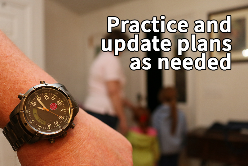 A close-up of a wristwatch on a person's arm times how quickly the rest of the family evacuates out the front door in a fire drill. Text reads, "Practice and update plans as needed."