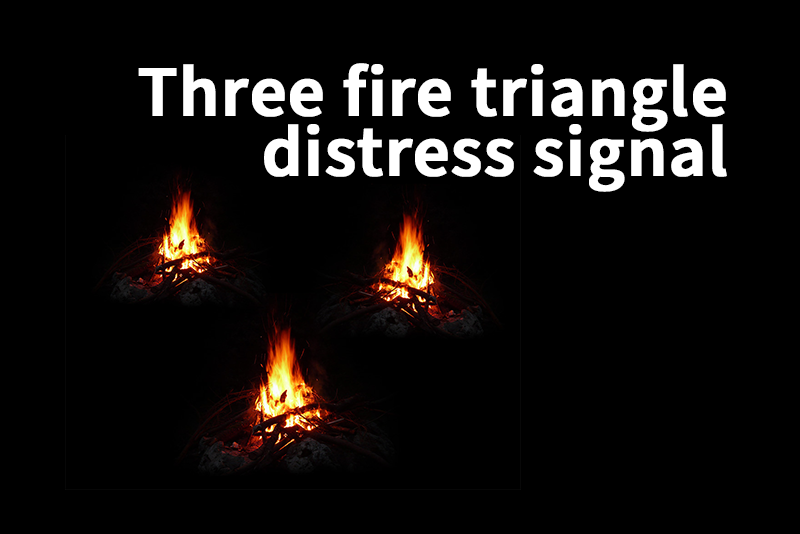Three campfires at night arranged in a triangular formation with the text "Three fire triangle distress signal."