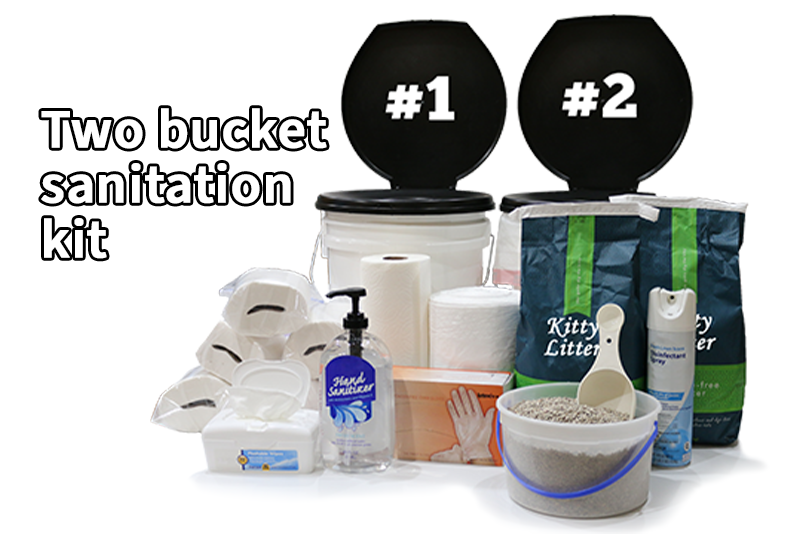 Two bucket sanitation kit consisting of two five gallon buckets with toilet seat lids, six rolls of toilet paper in a bags, a roll of paper towels, white kitchen sized garbage bags, spray disinfectant, disposable gloves, hand sanitizer, a box of baby wipes, and a one gallon bucket of kitty litter and a scoop.